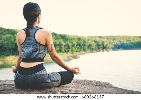 Beautiful women yoga in nature, hipster tone and selective focus