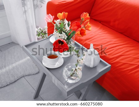 Interior of modern veranda with beautiful flowers on table