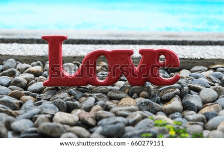 Image of bright red love letter on marble with swimming pool for romance concept background