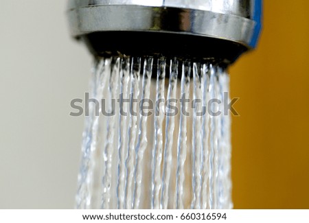 Water flows from the shower.
