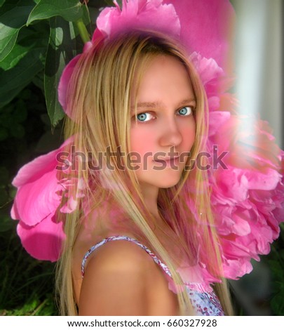 Beautiful blonde girl with flower on background