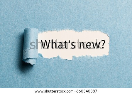 torn paper revealing the phrase "what's new?" Royalty-Free Stock Photo #660340387