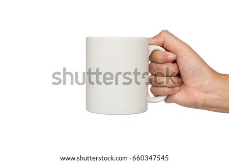 Hands holding white cup of coffee or tea on white background. Royalty-Free Stock Photo #660347545