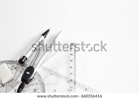 Geometry set with compass, ruler and protractor  on white background, 2018 calendar Construction