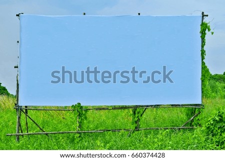 Blank  sign with blue vinil on old wood frame nad nature background
