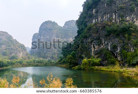 Trang An, Tam Coc, Ninh Binh, Vietnam. It's is object of World Heritage Site, renowned for its boat cave tours by the river.