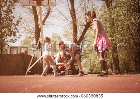 Caucasian family playing basketball together. Happy family spending free time together.