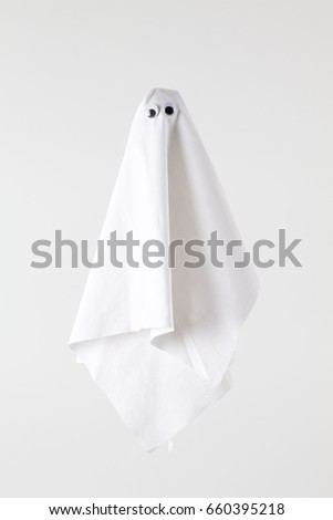 white sheet ghost isolated on a white background. Tones on tones photography