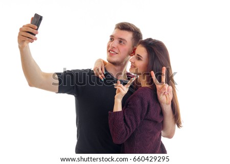 cute young couple make selfie in Studio