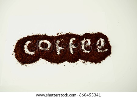 "Coffee" word written on ground coffee layer. 