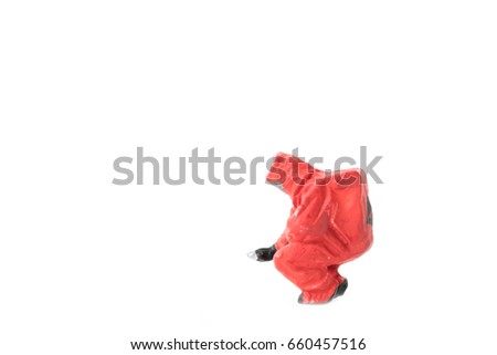 Miniature people  firefightes in hazmat suits construction concept on white background with a space for text