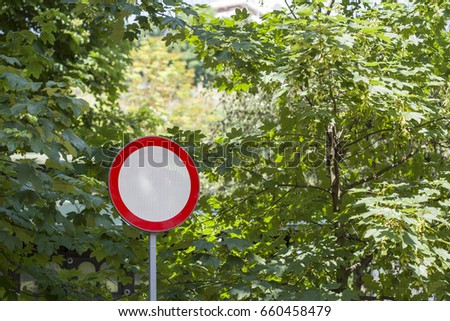 Forbidden traffic sign near a forest