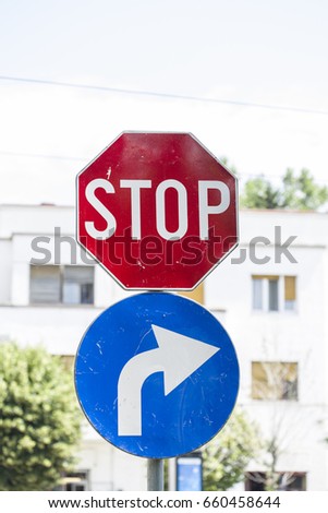 Stop and mandatory to the right traffic sign
