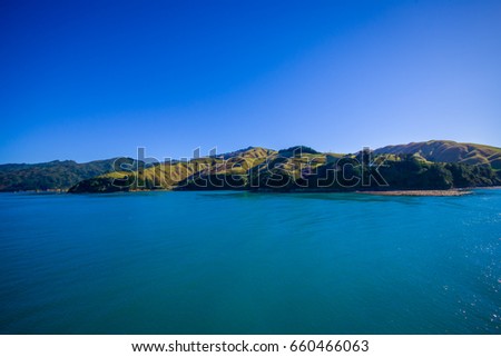 Beautiful landscape of mountain with gorgeous blue sky in a sunny day seen from ferry from north island to south island, in New Zealand