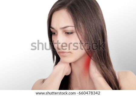 She touches the red dot with pain and suffers from chronic neck pain from hard work. Isolated on white background. She wants to treat pain. Concept office syndrome.