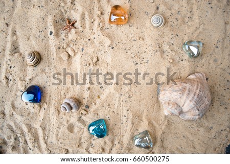Hearts on a sandy sunny beach with a blurred background