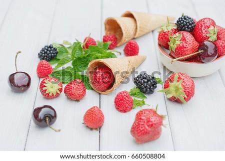 Composition with strawberries, cherries, raspberries and blackberries