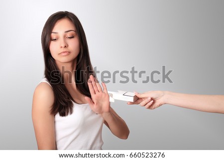 Healthy Young Woman Refusing To Take Cigarette From Pack. Portrait Of Beautiful Female Showing Stop Sign With Hand To Cigarettes. Quit Smoking Concept. High Resolution