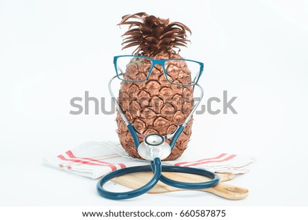 A pineapple in doctor and health care concept.