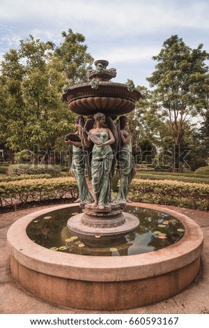 Woman statue fountain in garden