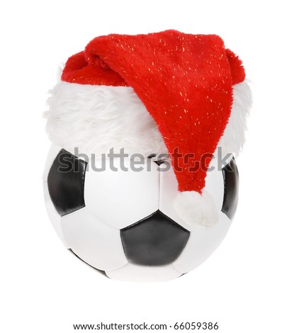 Santa Claus hat on the soccer ball on the white background. (isolated)