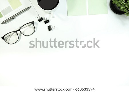 Hero header Modern white desk office table with notepaper pen and space. Top view with copy space, flat lay.