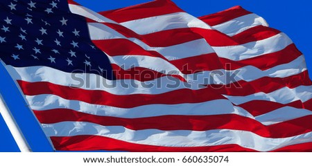 American flag on the blue sky