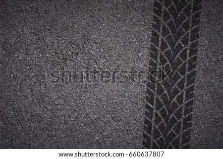 tire tread pattern on asphalt background Royalty-Free Stock Photo #660637807