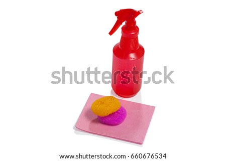 Spray bottle, scrubbers and cleaning pad arranged on white background