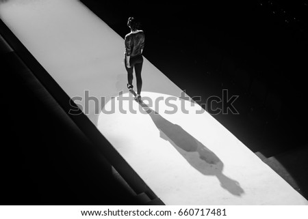 Models on the catwalk during the fashion show Royalty-Free Stock Photo #660717481