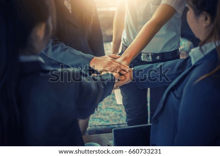 Business people coordinate hands in office. Concept Teamwork.