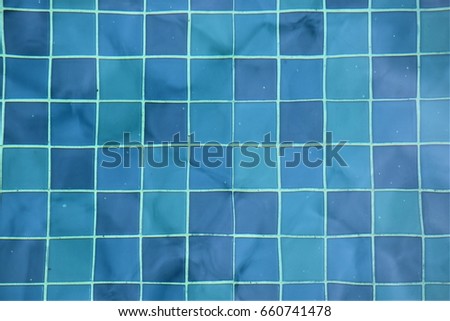 Swimming pool tiles under water background Royalty-Free Stock Photo #660741478