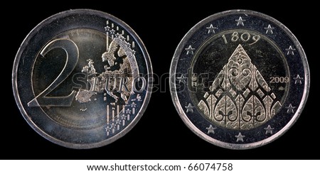 The commemorative euro coin from Finland on the black background
