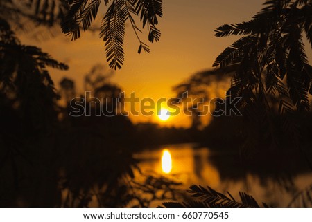 Calm lake at sunset,beautiful evening,picture frame