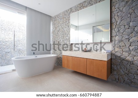 Luxury bathroom features basin, toilet bowl and bathtub home, house, building Royalty-Free Stock Photo #660794887