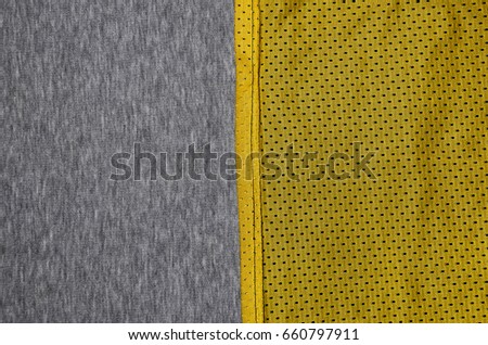 Top view of cloth textile surface. Close-up rumpled heater and knitted fabric texture with a thin striped pattern. Sport clothing fabric texture. Colored basketball shirt and heater hoodie