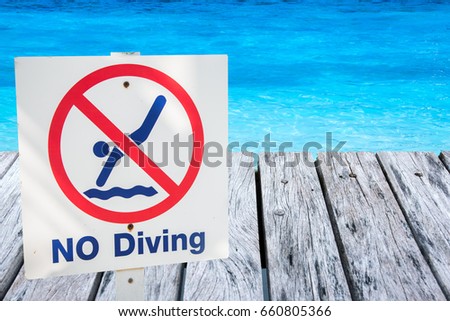 warning sign for safety at swimming pool.
