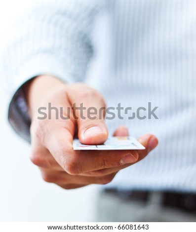 Male hand showing credit card