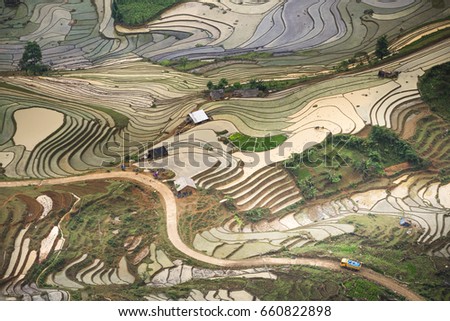 Beautiful picture of terraced rice fields in a spilling water season in the northwestern part of Lao Cai province, Vietnam. Preparing for rice cultivation