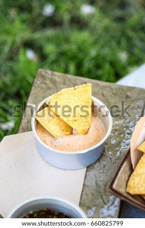 Picnic nachos with sauces outdoor summer