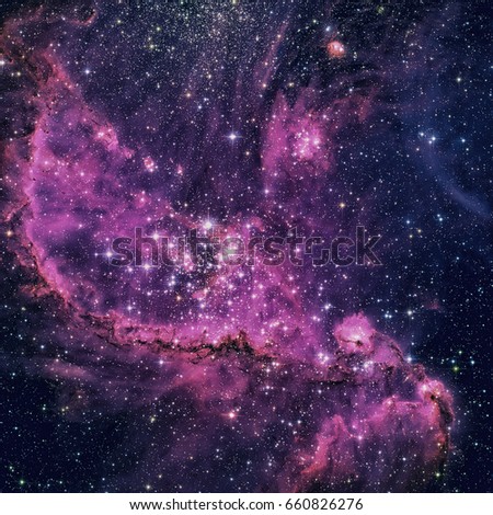 open cluster with associated nebula located in the Small Magellanic Cloud that appears in the constellation Tucana. Retouched colored image. Elements of this image furnished by NASA.
