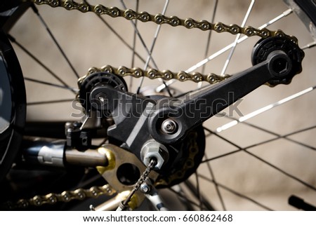 Black plastic bicycle chain  tensioner Royalty-Free Stock Photo #660862468