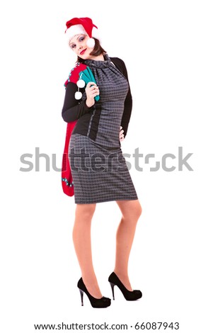 Stock photo on the white background. Business woman in black dress and hats of Santa Claus wishes us a Merry Christmas.