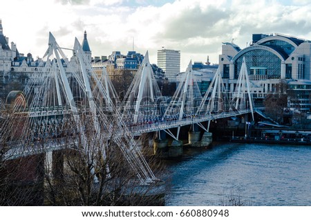 North view of the Hungerford and Golden Jubilee bridges on the River Thames, London