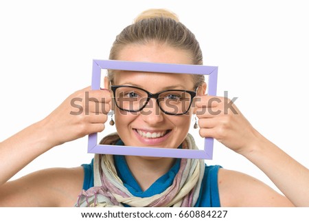 Beautiful girl in a picture frame on a white background