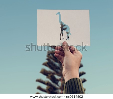 Hand Hold Giraffe Paper Carving with Pine Tree