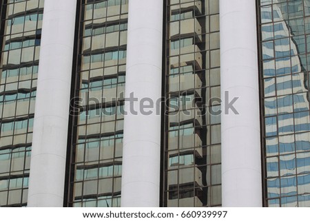 Wall of tall building or glass of skyscraper background for design in your work backdrop.