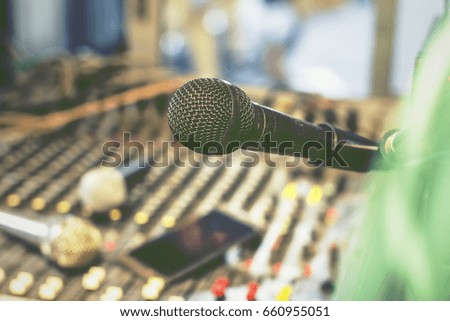 The microphone on the audio mixer. In the recording studio.