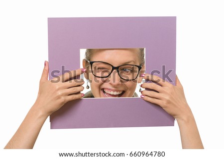 Beautiful girl in a picture frame on a white background