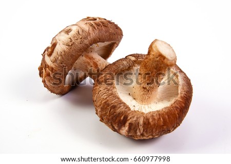 Fresh Shiitake mushroom  isolated on white background. Royalty-Free Stock Photo #660977998